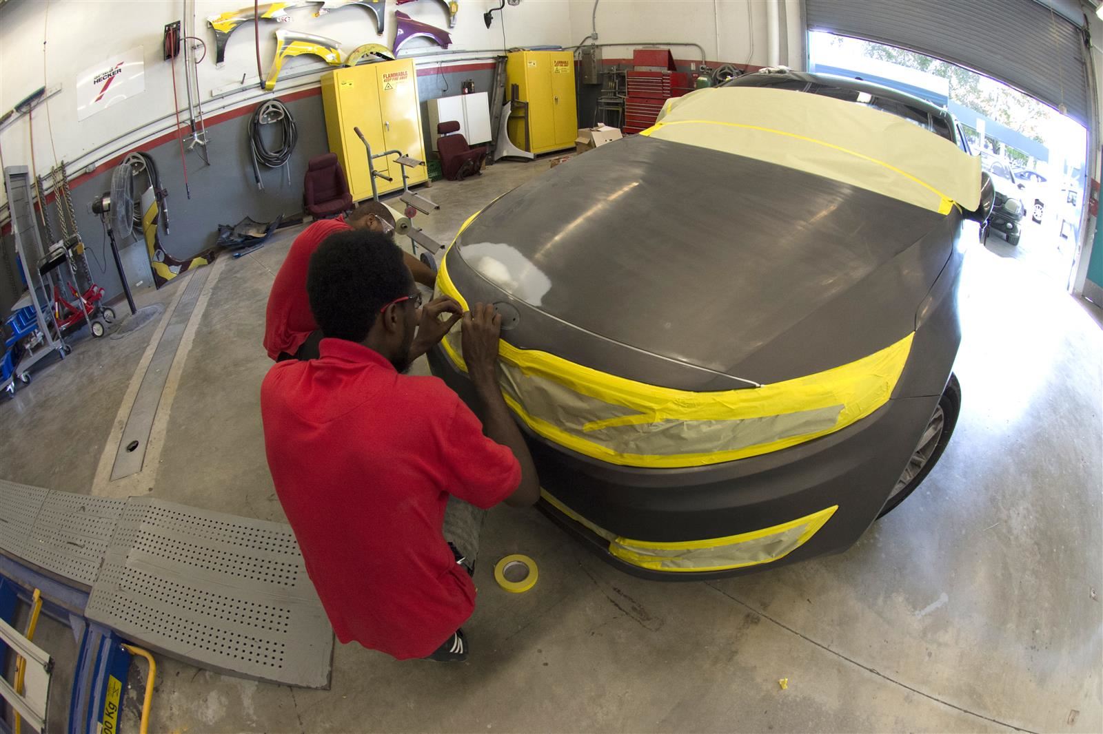 student preparing car to paint student preparing car to paint