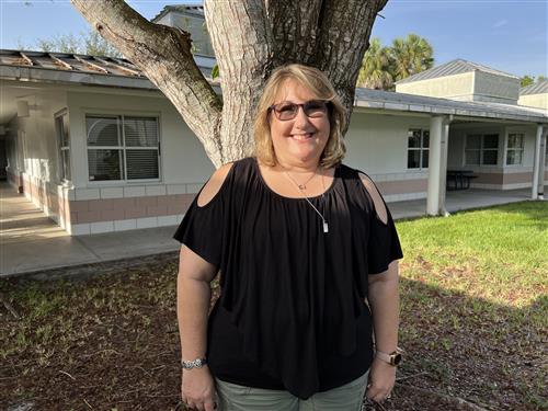 Mrs. Cohen standing outside the fourth grade building
