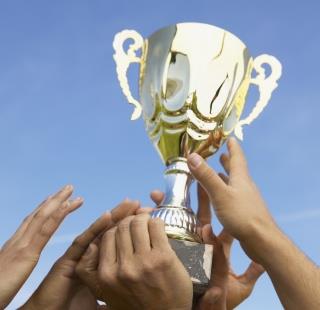Trophy being held up 