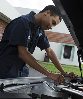 Person Working On Car Engine Person Working On Car Engine