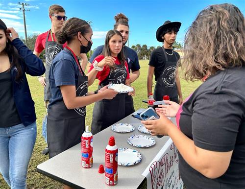 Students getting the Whipped Cream