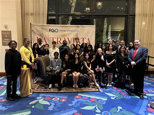 chorus members dressed up nice for opera