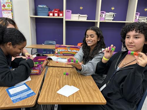 students using blocks to spell words