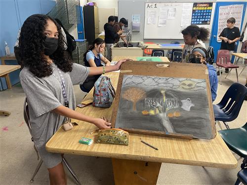 art student with drawing