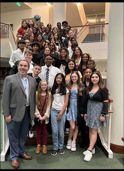 chorus students standing on stairs
