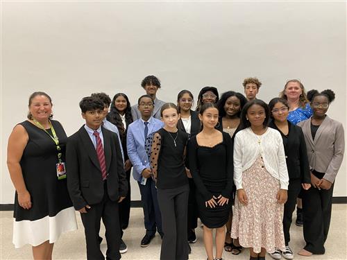 debate students at tournament with Dr. Norris