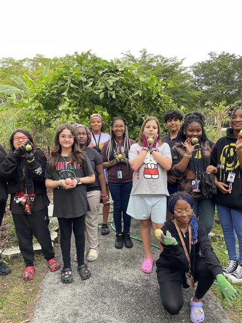 students smiling in garden