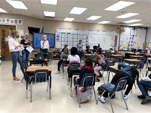 Adult volunteers share their time and knowledge.
