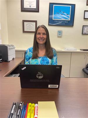Kathleen Neville at her desk.