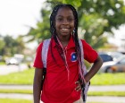  Student with red Horizon Elementary Polo shirt
