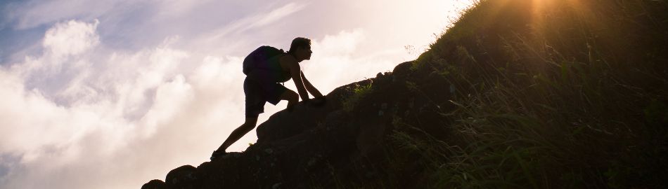 person climbing mountain person climbing mountain