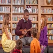  Students learning musical instrument. 
